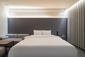 Katil atau katil-katil dalam bilik di Hotel THE ART UIWANG
