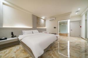 Katil atau katil-katil dalam bilik di Hotel THE ART UIWANG