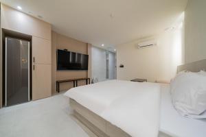 Katil atau katil-katil dalam bilik di Hotel THE ART UIWANG