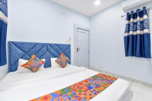 Postel nebo postele na pokoji v ubytování FabHotel Somnath + 22 fotografií