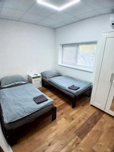 Posteľ alebo postele v izbe v ubytovaní Dimael Hostel & Apartments