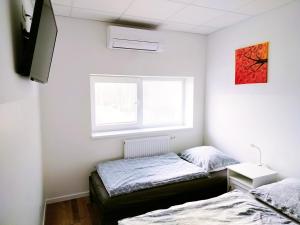 Posteľ alebo postele v izbe v ubytovaní Dimael Hostel & Apartments