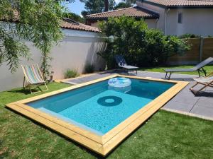 Swimmingpoolen hos eller tæt på Maison avec piscine Pyla sur mer + 2 billeder