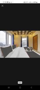 Postel nebo postele na pokoji v ubytování Himalayan view stay - Pahado wala ghar