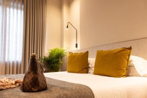 Letto o letti in una camera di Hotel Leopardi