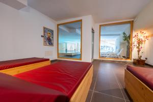 Postel nebo postele na pokoji v ubytování Alpine Mugon Hotel