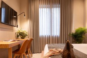 TV o dispositivi per l'intrattenimento presso Hotel Leopardi