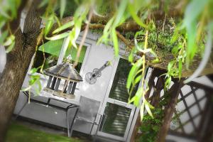 a view of a house with a table and chairs at The Studio, Ascot in Winkfield