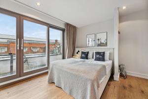 Ένα ή περισσότερα κρεβάτια σε δωμάτιο στο Limehome Berlin Prenzlauer Allee - Digital Access