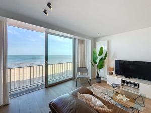 Una televisión o centro de entretenimiento en Flat Sealodge - Koksijde