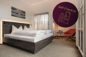 Postel nebo postele na pokoji v ubytování Hotel Spitzerberg by b-smart