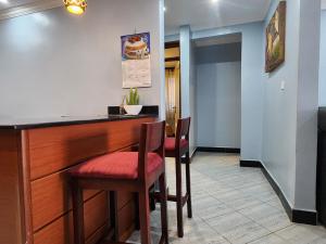 TV a/nebo společenská místnost v ubytování Del Cielo Serviced Apartments