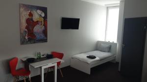 Postel nebo postele na pokoji v ubytování BYTOM SQUARE