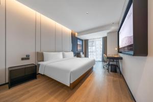Postel nebo postele na pokoji v ubytování Atour Hotel Chengdu Qingyang Zhongba