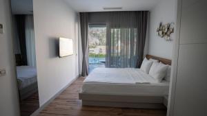 Кровать или кровати в номере Z-Villas Beach Hotel +37 фотографий