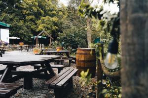 a group of picnic tables in a park at The Pheasant Inn - The Inn Collection Group in Bassenthwaite