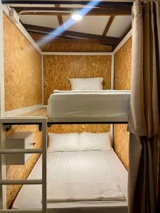 a room with two bunk beds in it at Seaside Cenang in Pantai Cenang +21 photos