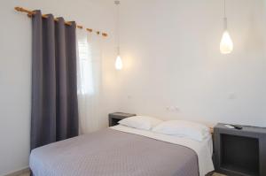 Postel nebo postele na pokoji v ubytování Skala Sunset Hotel and spa