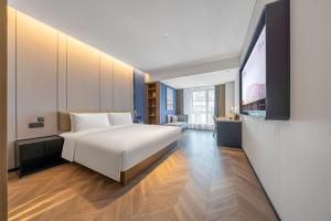 TV a/nebo společenská místnost v ubytování Atour Hotel Chengdu Qingyang Zhongba