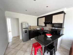 Kuchyň nebo kuchyňský kout v ubytování The JBay Oasis + 9 fotografií