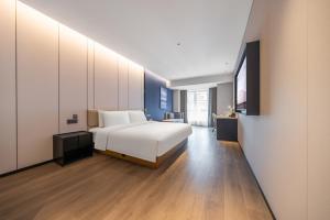 Postel nebo postele na pokoji v ubytování Atour Hotel Chengdu Qingyang Zhongba