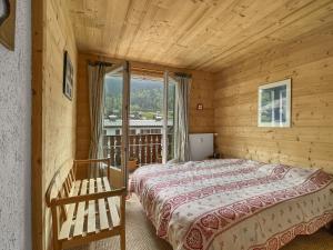 Ένα ή περισσότερα κρεβάτια σε δωμάτιο στο Appartement 8 Pers Centre Station Carroz (ARA32)