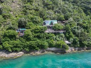 an aerial view of a house on a hill above the water at Kaaimans River Rustic Views in Wilderness