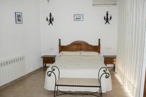 Postel nebo postele na pokoji v ubytování Hotel Juan Francisco