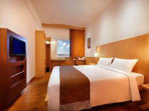 Postel nebo postele na pokoji v ubytování Ibis Bali Kuta + 34 fotografií