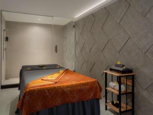 Postel nebo postele na pokoji v ubytování AIHO Hotel Medan