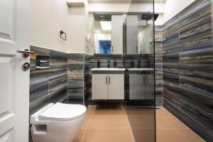a bathroom with a toilet and a sink and a mirror at by Abraham Galata in Istanbul +26 photos