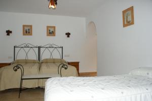 Postel nebo postele na pokoji v ubytování Hotel Juan Francisco