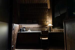 a kitchen with a counter and a chair in a room at Nivunki Village in Muonio +37 photos