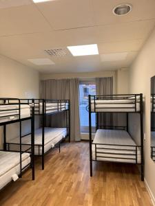 Postel nebo postele na pokoji v ubytování Nomad City