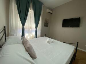 A bed or beds in a room at Key-Rome Re di Roma