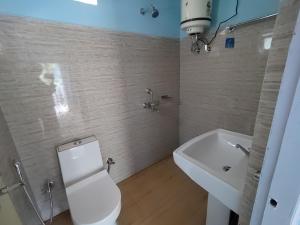 Koupelna v ubytování Raniban Home