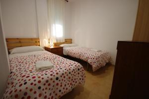 Postel nebo postele na pokoji v ubytování Livingtarifa- Apartamento Tucán