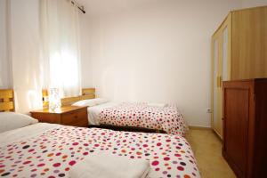 Postel nebo postele na pokoji v ubytování Livingtarifa- Apartamento Tucán