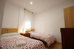 Postel nebo postele na pokoji v ubytování Livingtarifa- Apartamento Tucán