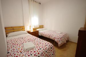 Postel nebo postele na pokoji v ubytování Livingtarifa- Apartamento Tucán
