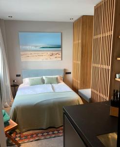 A bed or beds in a room at 203 Estudio Suite Tranquilo