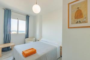 Posteľ alebo postele v izbe v ubytovaní Livingtarifa Apartamento La Duna