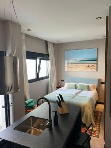 A bed or beds in a room at 203 Estudio Suite Tranquilo