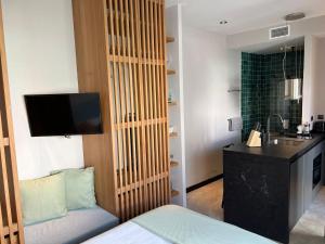 A bed or beds in a room at 203 Estudio Suite Tranquilo