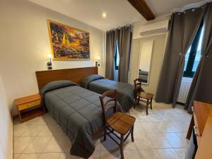 Voodi või voodid majutusasutuse Hotel Duca di Tromello toas