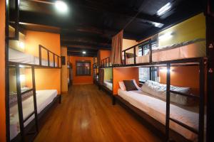 Rúm í herbergi á Antique Hostel Nepal