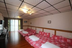 Postel nebo postele na pokoji v ubytování First Place B&B (Hualien Railway Station)