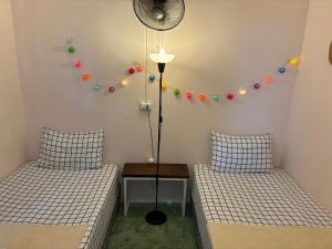 Postel nebo postele na pokoji v ubytování Phangan Villa Bungalows