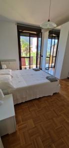 Ένα ή περισσότερα κρεβάτια σε δωμάτιο στο La casa della Nonna Sara