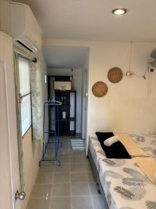 Postel nebo postele na pokoji v ubytování Phangan Villa Bungalows